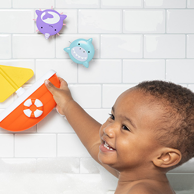 ZOO® Tip & Spin Boat Baby Bath Toy helps teach cause and effect