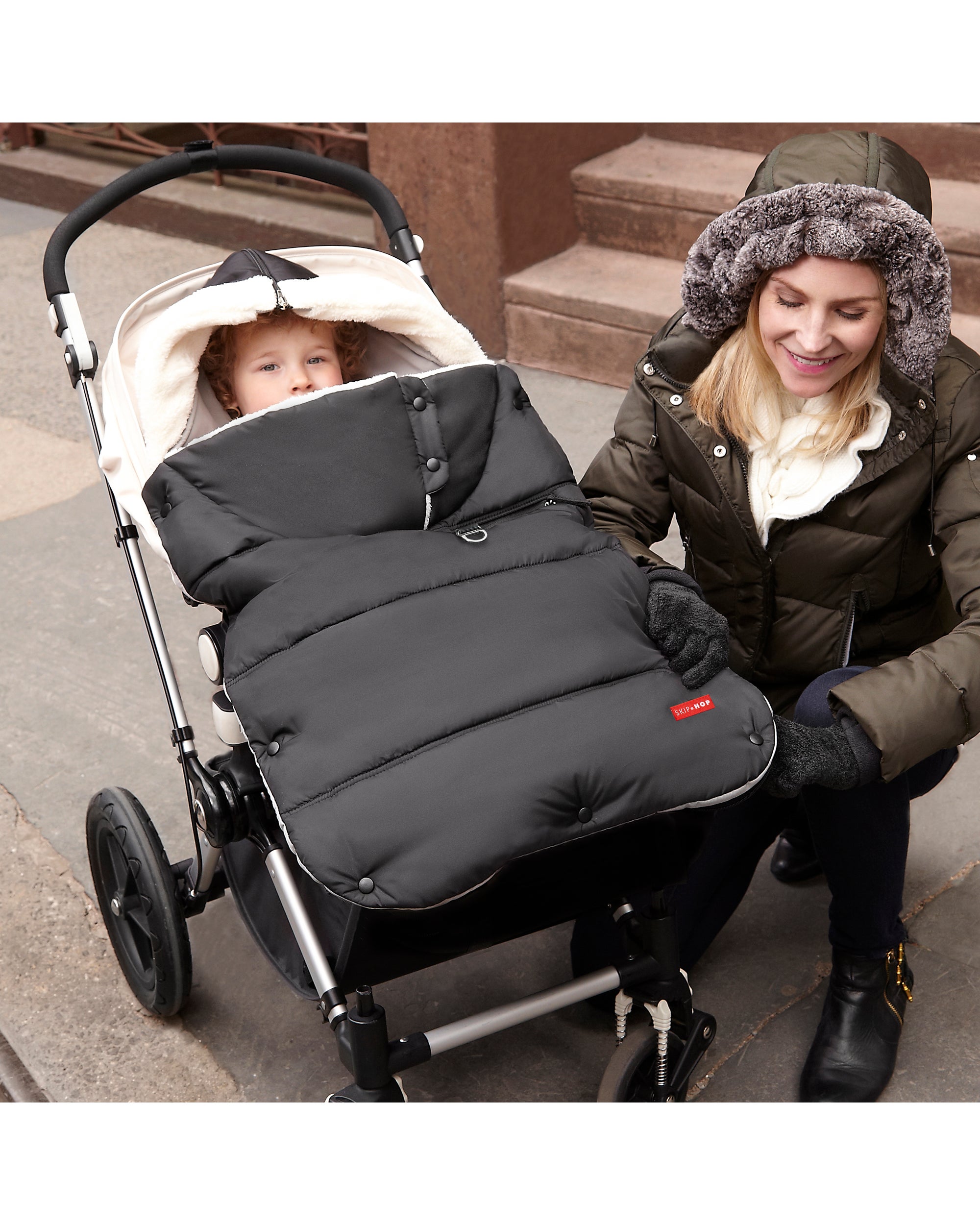 black stroller with footmuff